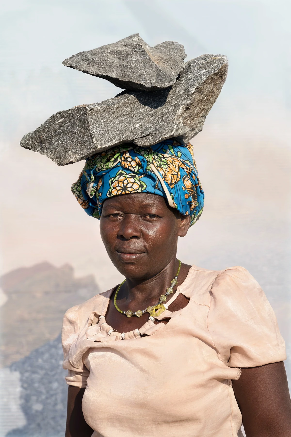 A Ugandan quarry worker carrying rocks on her head: Dan Nelken’s best photograph